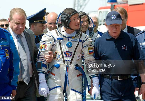In this handout photo provided by the European Space Agency , The Soyuz TMA-15 crew member, Russian cosmonaut Roman Romanenko arrives during...