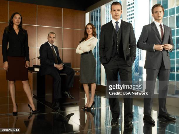 Season 1 -- Pictured: Gina Torres as Jessica Pearson, Rick Hoffmann as Louis Litt, Meghan Markle as Rachel Zane, Gabriel Macht as Harvey Specter,...