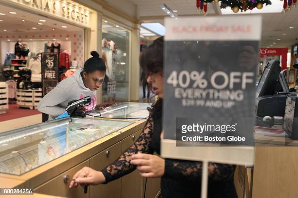 Juanita Sanford, left, looks at jewelry for sale at the Westgate Mall in Brockton, MA on Black Friday, Nov. 24, 2017.