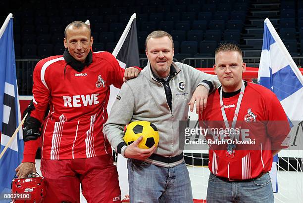 Matthias Scherz, player of Bundesliga team 1. FC Koeln, TV host Stefan Raab and comedian Axel Stein pose for the media during the "Deutscher...