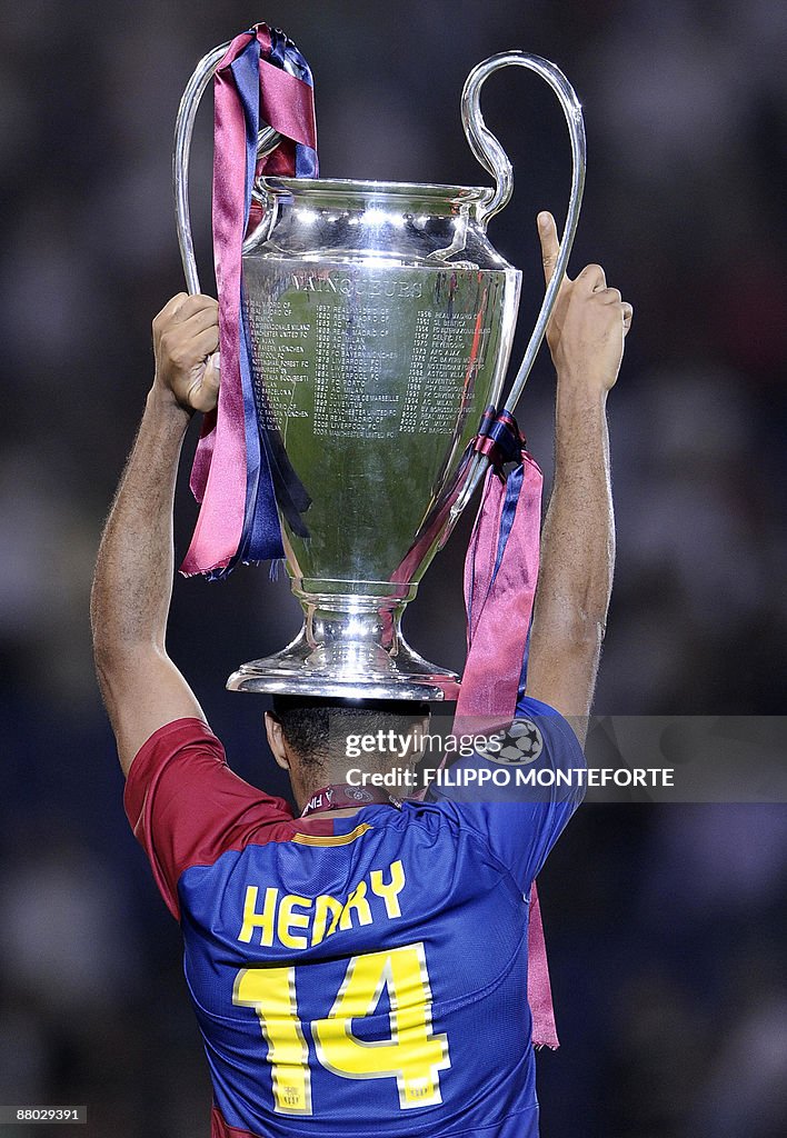 Barcelona's Thierry Henry celebrates wit
