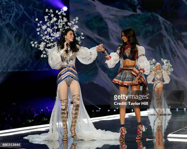 Ming Xi and Gizele Oliveira walk the runway during the 2017 Victoria's Secret Fashion Show at Mercedes-Benz Arena on November 20, 2017 in Shanghai,...