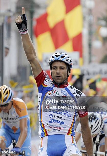 Italy's Michele Scarponi celebrates as he crosses the finish line to win the eightteenth stage of 92nd Giro of Italy between Sulmona and Benevento on...