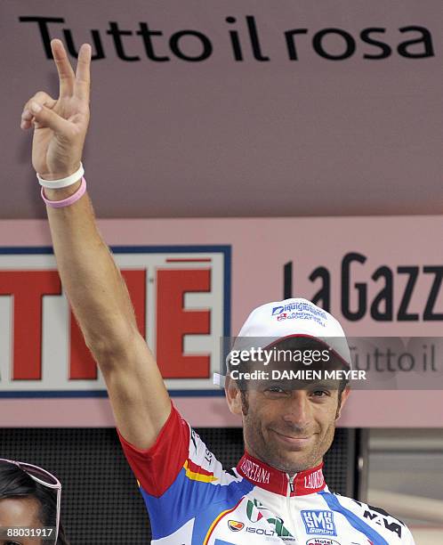 Italy's Michele Scarponi celebrates on the winner stand after he carried off the eightteenth stage of 92nd Giro of Italy between Sulmona and...