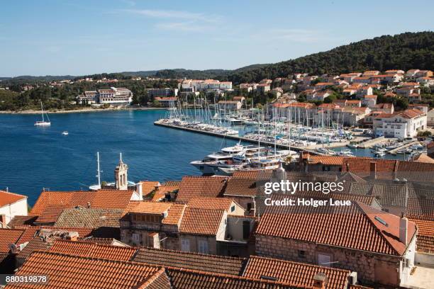 overhead of old town rooftops and marina seen from bell tower of st. mark's cathedral, korcula, dubrovnik-neretva, croatia - korcula island stock pictures, royalty-free photos & images