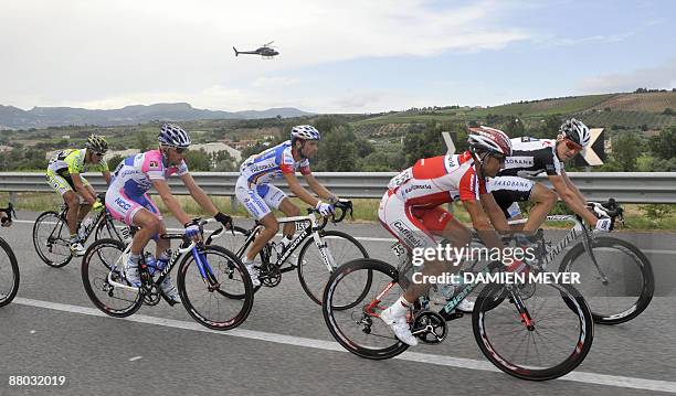 An helicopter shoots riders who escaped during a breakaway including today's winner Italy's Michele Scarponi during the eigthteenth stage of 92nd...
