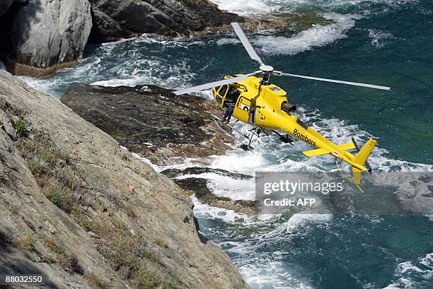 An helicopter hovers the site where the body of a six-year-old German girl less than 24 hours was found at the foot of a cliff, near Ermita de Sant...