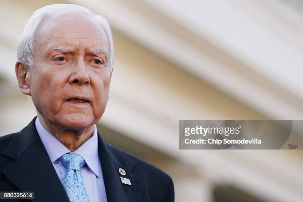 Senate Finance Committee Chairman Orrin Hatch talks with reporters following a lunch meeting with U.S. President Donald Trump at the White House...