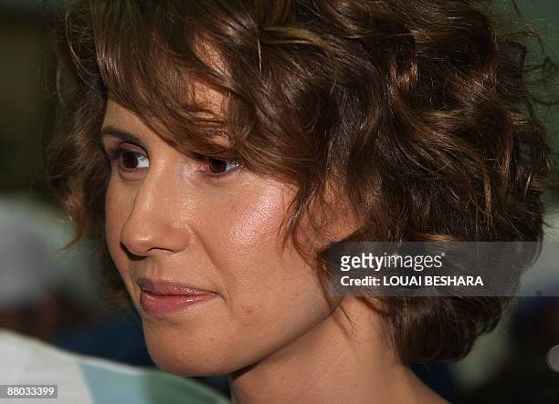 Syrian First Lady Asma al-Assad attends the opening ceremony of the Syrian Special Olympics for mentally challenged athletes in Damascus on May 28,...