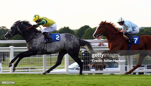 Geordieland ridden by jockey Shane Kelly lead Patkai ridden by jockey Ryan Moore to land The Blue SquareHenry II Stakes Race run at Sandown...