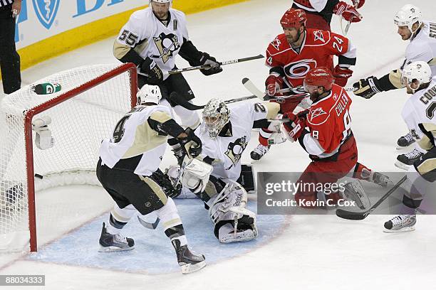 Matt Cullen of the Carolina Hurricanes takes a shot against goalie Marc-Andre Fleury of the Pittsburgh Penguins during Game Three of the Eastern...