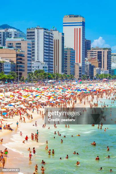 crowded ipanema beach - rio de janeiro, brazil - ipanema beach stock pictures, royalty-free photos & images