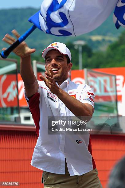 Alex De Angelis of Rep. San Marino and San Carlo Honda Gresini waves a flag during the pre-event, Sbandieratori of Florence at the Mugello Circuit on...