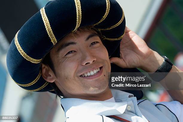 Hiroshi Aoyama of Japan and Scot Racing Team 250cc smiles to the photographers during the pre-event Sbandieratori of Florence on Mugello Circuit on...