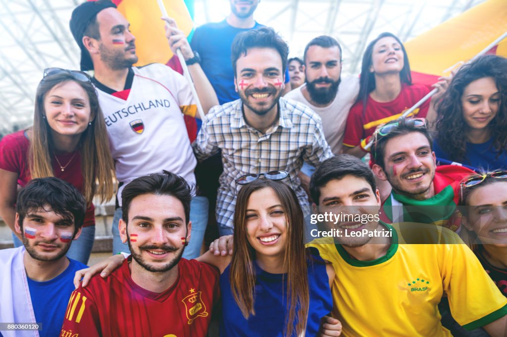 Team Roster Fans Group Of Different Team Fans Together At Stadium During A Football ...