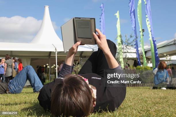 Festival-goers use the Reader from Sony during the Guardian Hay Festival on May 28, 2009 in Hay-on-Wye, England. Sony, a new sponsor of the Guardian...