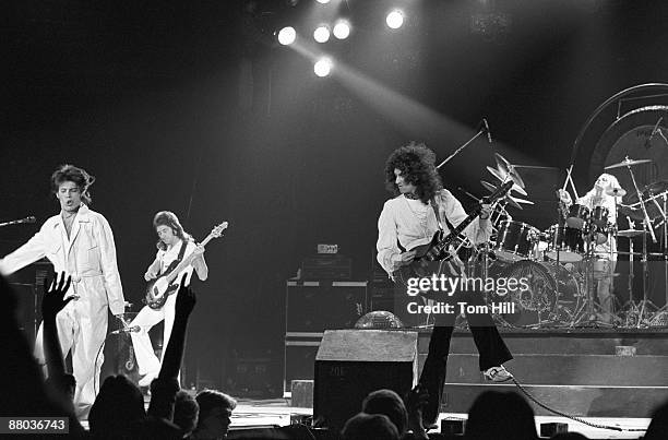 Singer-frontman Freddie Mercury, bassist John Deacon, guitarist Brian May and drummer Roger Taylor perform at the Omni Coliseum on February 21, 1977...