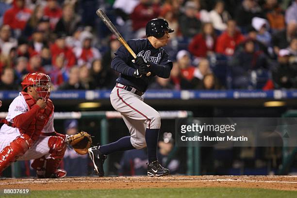 Second baseman Kelly Johnson of the Atlanta Braves swings at a pitch during a game against the Philadelphia Phillies at Citizens Bank Park on April...