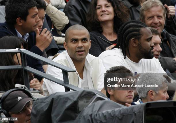 Tony Parker and guests attend the second round match between Switzerland's Roger Federer and Argentina's Jose Acasuso at the French Open tennis...