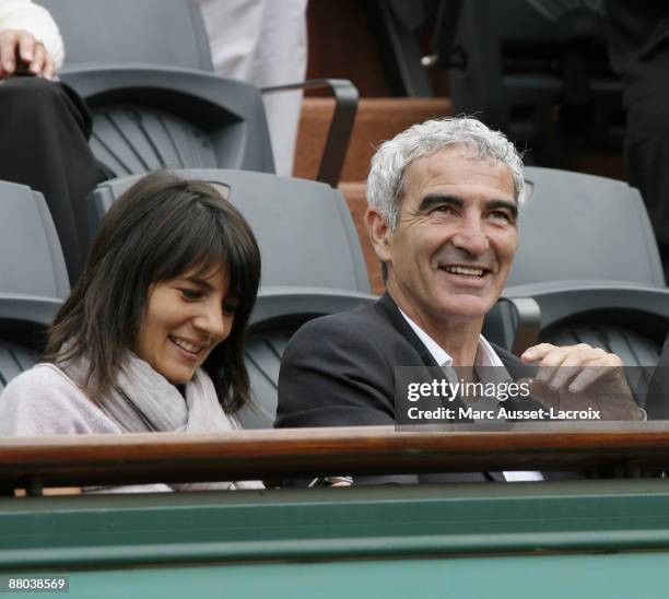 Estelle Denis and Raymond Domenech attend the second round match between Switzerland's Roger Federer and Argentina's Jose Acasuso at the French Open...