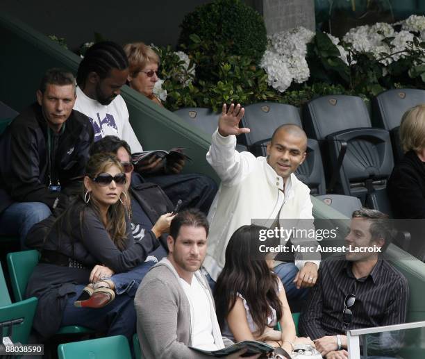 Tony Parker and guests attend the second round match between Switzerland's Roger Federer and Argentina's Jose Acasuso at the French Open tennis...