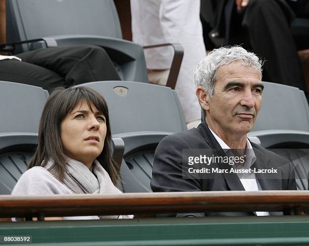 Estelle Denis and Raymond Domenech attend the second round match between Switzerland's Roger Federer and Argentina's Jose Acasuso at the French Open...