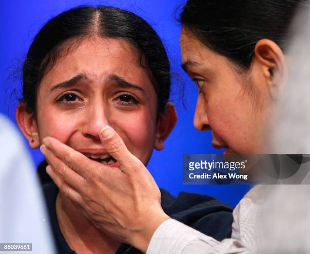 Tussah Heera of Las Vegas, Nevada, is comforted by her mother Priti after she misspelled the word "herniorrhaphy" and was eliminated during round...
