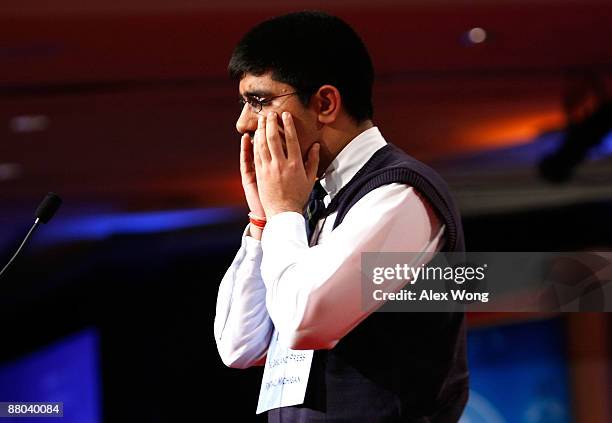 Speller Sidharth Chand of Bloomfield Hills, Michigan, reacts after he misspelled the word "apodyterium" and was eliminated during round eight of the...