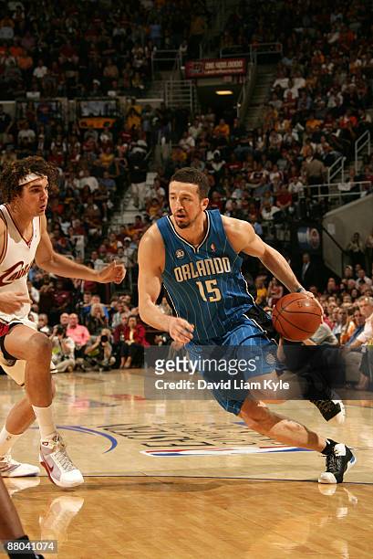 Hedo Turkoglu of the Orlando Magic drives past Anderson Varejao of the Cleveland Cavaliers in Game Five of the Eastern Conference Finals during the...