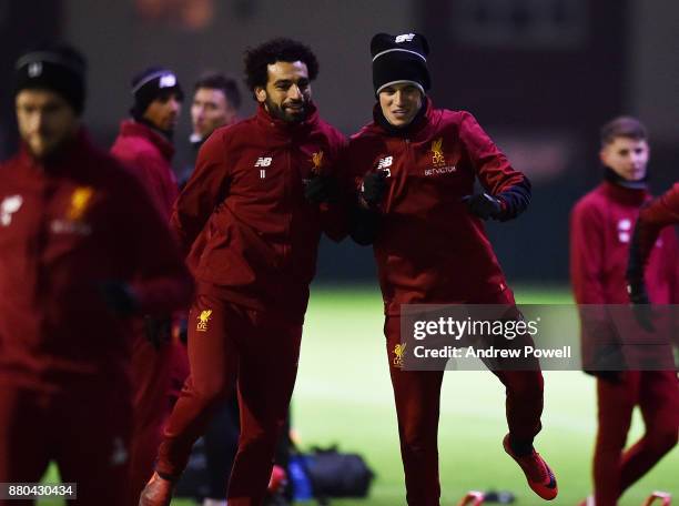 Mohamed Salah and Philippe Coutinho of Liverpool during a training session at Melwood Training Ground on November 27, 2017 in Liverpool, England.