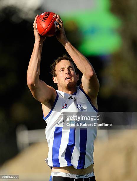 David Hale of the Kangaroos marks on during a North Melbourne Kangaroos AFL training session held at Arden Street Oval on May 29, 2009 in Melbourne,...