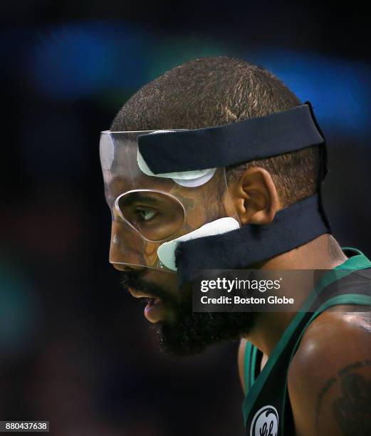 Boston Celtics' Kyrie Irving wears his face mask during the second quarter. The Boston Celtics host the Orlando Magic in a regular season NBA...