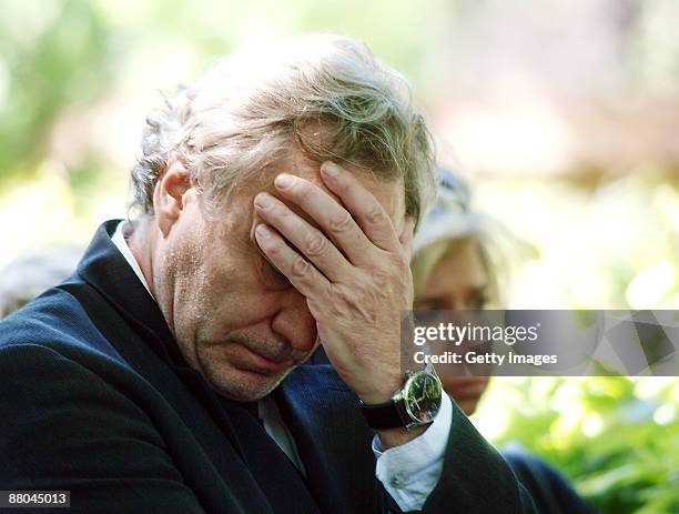 Gerd Silberbauer, friend of Barbara Rudnik mourns during the funeral of German actress Barbara Rudnik at Nordfriedhof cemetery on May 29, 2009 in...