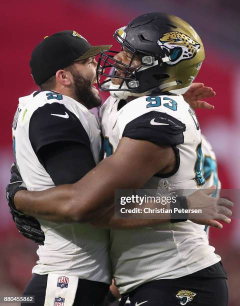 Quarterback Blake Bortles and defensive end Calais Campbell of the Jacksonville Jaguars celebrate after Campbell scored a touchdown against the...