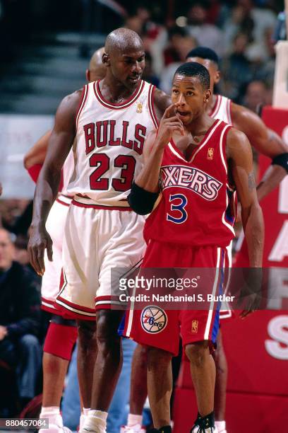 Michael Jordan of the Chicago Bulls and Allen Iverson of the Philadelphia 76ers talk during a game played on November 2, 1996 at the United Center in...