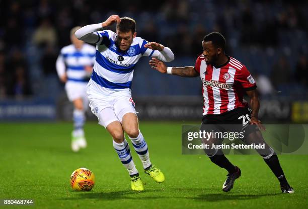 Jamie Mackie of Queens Park Rangers and Josh Clarke of Brentford in action during the Sky Bet Championship match between Queens Park Rangers and...