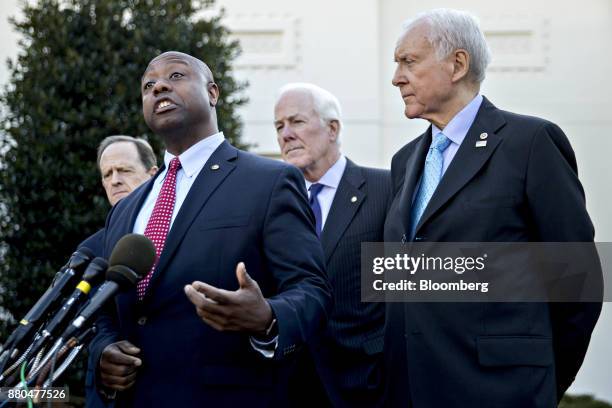 Senator Tim Scott, a Republican from South Carolina, second left, speaks to members of the media as Senator Orrin Hatch, a Republican from Utah and...