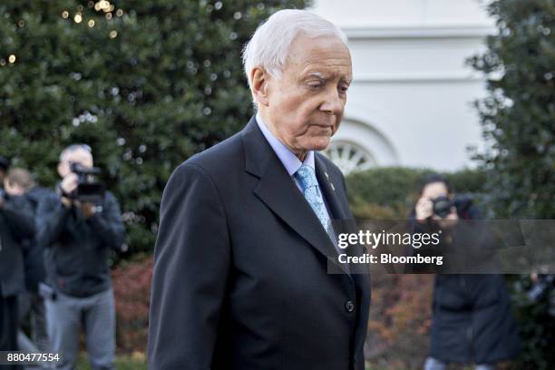 Senator Orrin Hatch, a Republican from Utah and chairman of the Senate Finance Committee, walks towards the White House after speaking to members of...