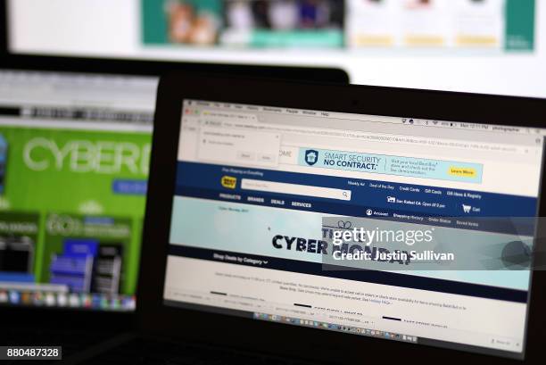 In this photo illustration, an ad seen on the Best Buy website for a Cyber Monday sale is displayed on laptop computers on November 27, 2017 in San...