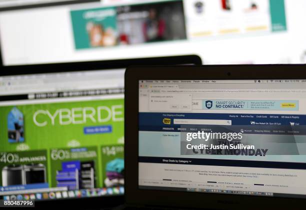 In this photo illustration, an ad seen on the Best Buy website for a Cyber Monday sale is displayed on laptop computers on November 27, 2017 in San...