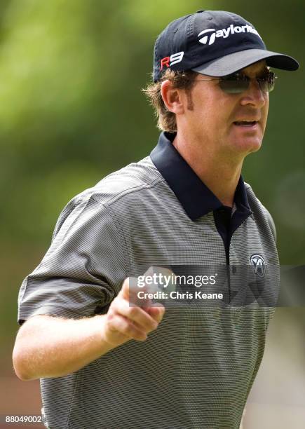 David Mathis waves after making a putt on the 17th hole during the second round of the Rex Hospital Open Nationwide Tour golf tournament at the TPC...