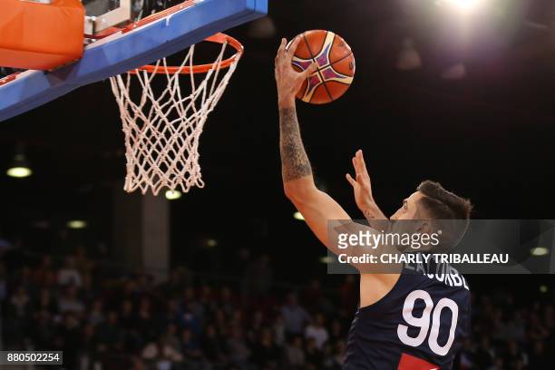 France's Paul Lacombe shoots to score during the FIBA Basketball World Cup 2019 qualifier between France and Bosnia at Kindarena Hall in Rouen,...