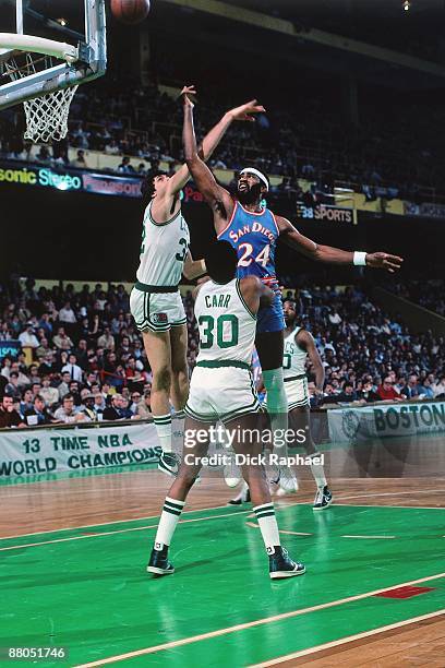 Gar Heard of the San Diego Clippers shoots a layup against Kevin McHale of the Boston Celtics during a game played in 1981 at the Boston Garden in...