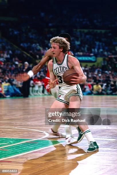 Larry Bird of the Boston Celtics drives to the baket against the Houston Rockets during the 1981 NBA Finals at the Boston Garden in Boston,...