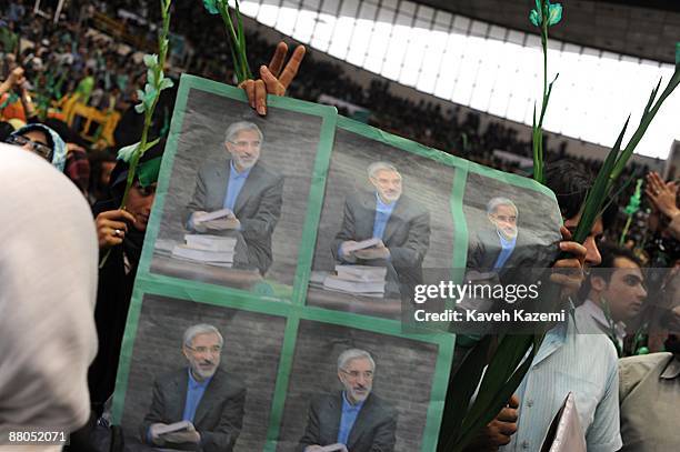 Supporters of presidential candidate Mir-Hossein Mousavi, the ex and last Prime Minister of Iran, participate in a rally attended by former president...