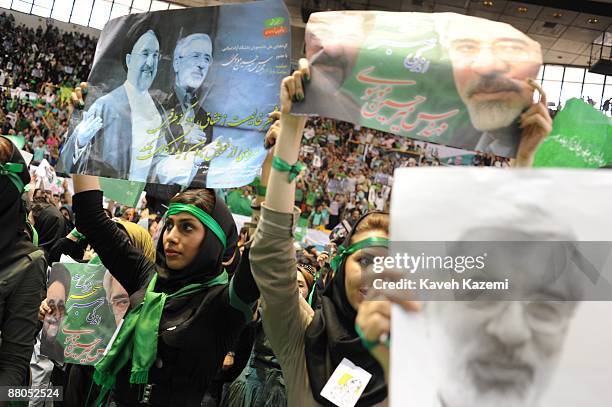 Supporters of presidential candidate Mir-Hossein Mousavi, the ex and last Prime Minister of Iran, participate in a rally attended by former president...