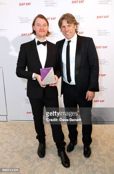 Host of the evening John Bishop poses with Best Takeaway Chef in Britain award winner, Benn Hodges of EatFirstin Aldgate, London, at the British...