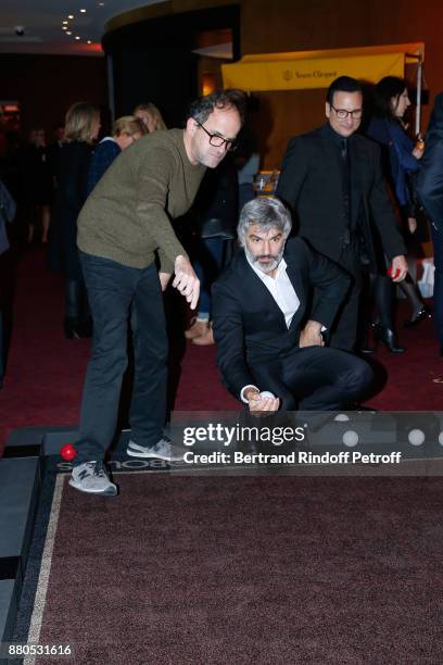 Lionel Abelanski and Francois Vincentelli play Boboules during the Inauguration of the "Chalet Les Neiges 1850" on the terrace of the Hotel "Barriere...