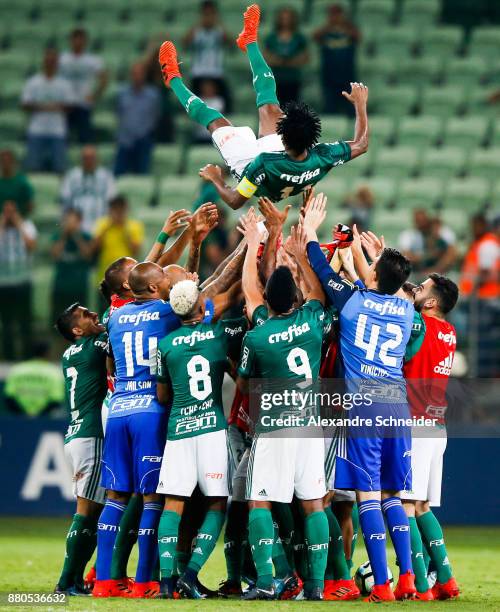 Ze Roberto of Palmeiras celebrates his last match as a professional player with his teammates after the match against Botafogo for the Brasileirao...