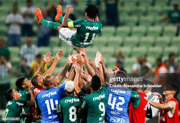 Ze Roberto of Palmeiras celebrates his last match as a professional player with his teammates after the match against Botafogo for the Brasileirao...